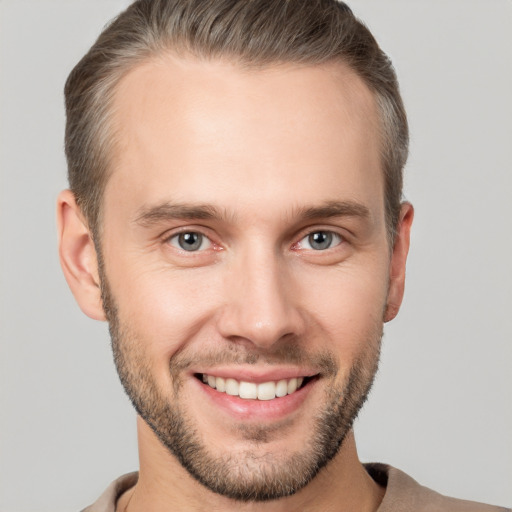 Joyful white young-adult male with short  brown hair and brown eyes