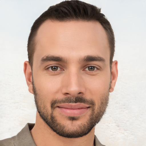 Joyful white young-adult male with short  brown hair and brown eyes