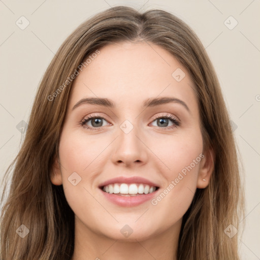 Joyful white young-adult female with long  brown hair and green eyes