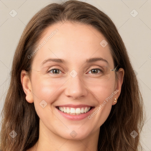 Joyful white young-adult female with long  brown hair and grey eyes