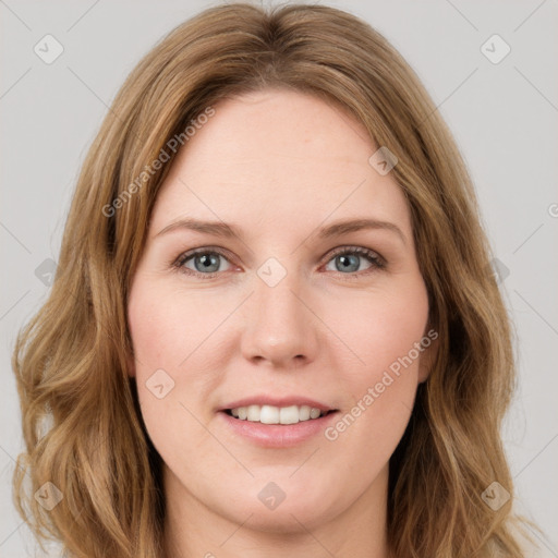 Joyful white young-adult female with long  brown hair and green eyes