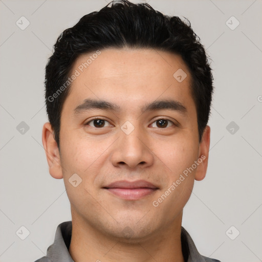 Joyful white young-adult male with short  black hair and brown eyes