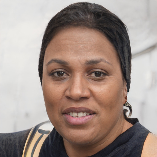 Joyful white adult female with short  black hair and brown eyes