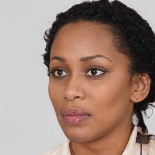 Neutral black young-adult female with short  black hair and brown eyes