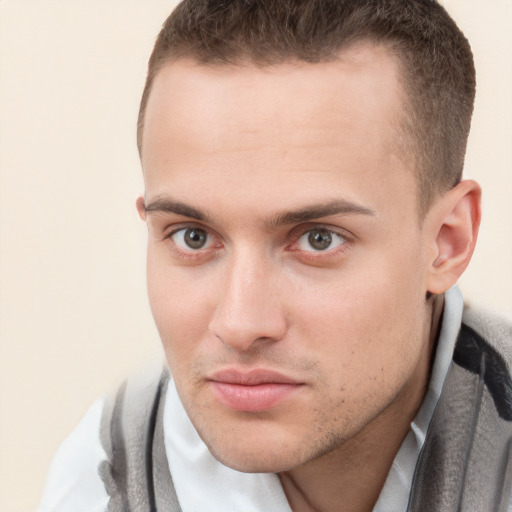 Neutral white young-adult male with short  brown hair and brown eyes