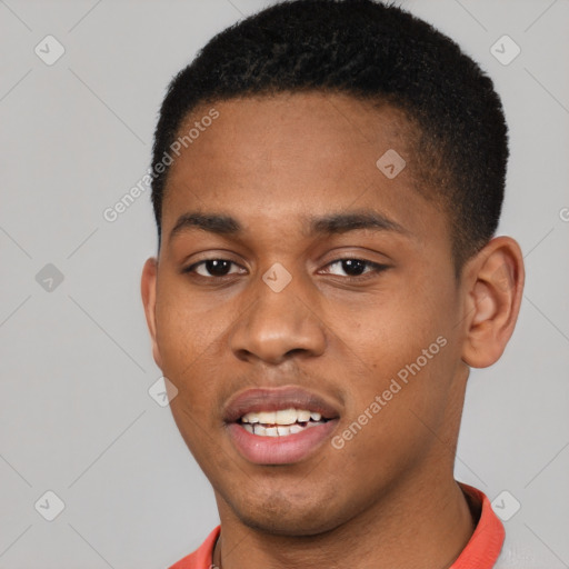 Joyful black young-adult male with short  black hair and brown eyes