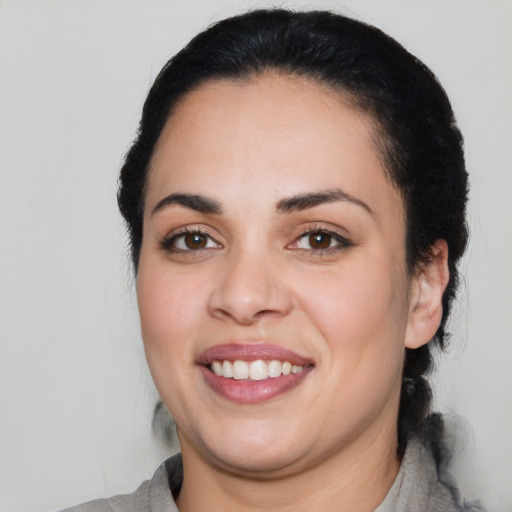 Joyful white young-adult female with medium  black hair and brown eyes