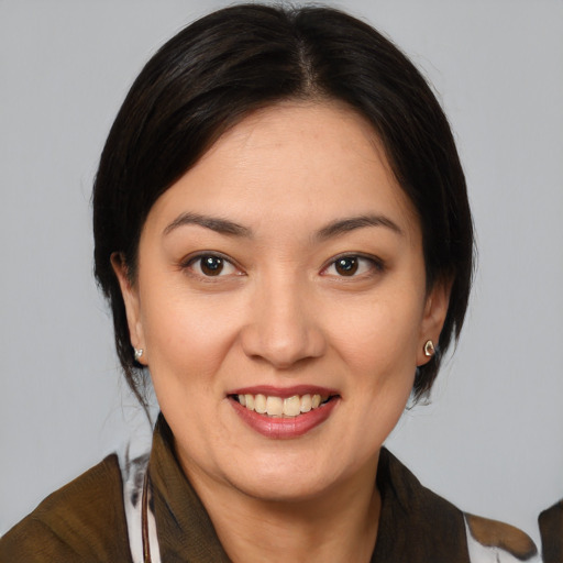 Joyful white young-adult female with medium  brown hair and brown eyes