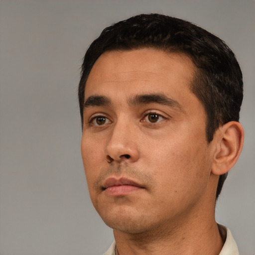 Neutral white young-adult male with short  black hair and brown eyes