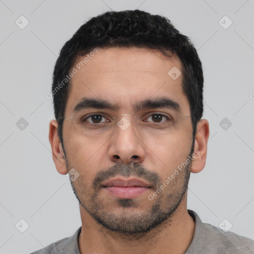 Neutral white young-adult male with short  black hair and brown eyes