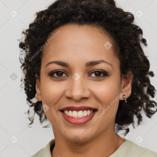 Joyful black young-adult female with medium  brown hair and brown eyes