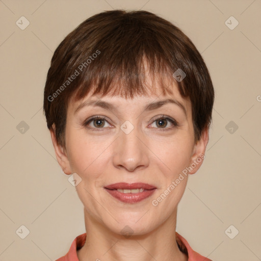 Joyful white adult female with short  brown hair and grey eyes