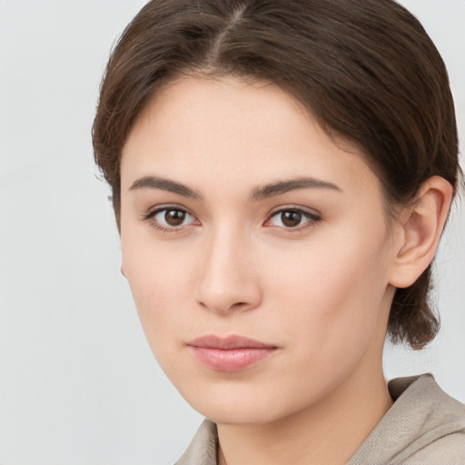 Neutral white young-adult female with medium  brown hair and brown eyes