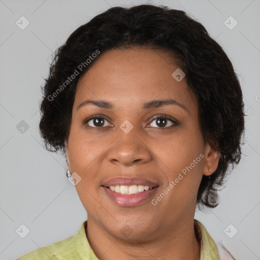 Joyful black adult female with short  brown hair and brown eyes