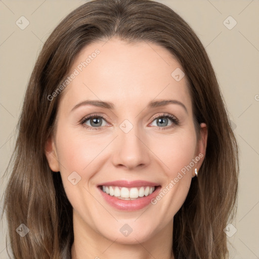 Joyful white young-adult female with long  brown hair and green eyes