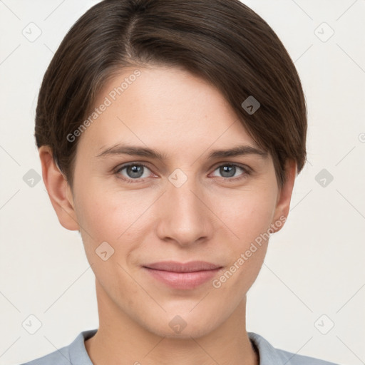 Joyful white young-adult female with short  brown hair and grey eyes