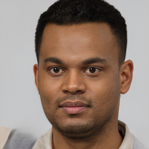 Neutral black young-adult male with short  black hair and brown eyes