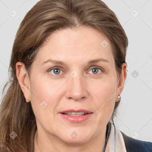 Joyful white adult female with medium  brown hair and grey eyes