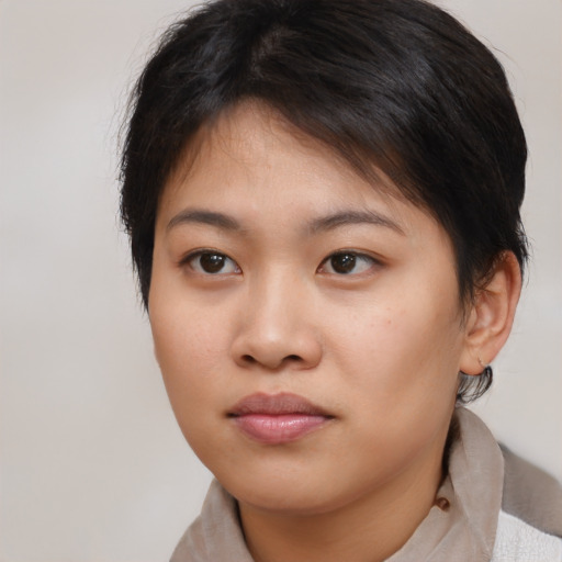 Neutral asian young-adult female with medium  brown hair and brown eyes