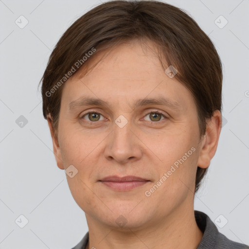 Joyful white adult female with short  brown hair and grey eyes