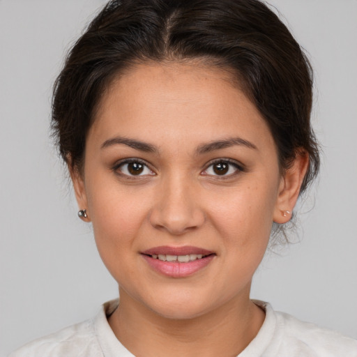 Joyful white young-adult female with medium  brown hair and brown eyes