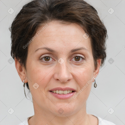 Joyful white adult female with short  brown hair and grey eyes