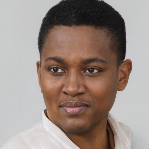 Joyful black young-adult female with short  black hair and brown eyes