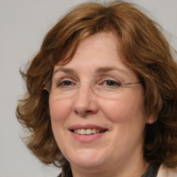 Joyful white adult female with medium  brown hair and grey eyes