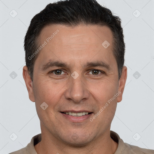 Joyful white adult male with short  brown hair and brown eyes