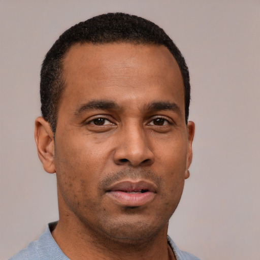 Neutral latino young-adult male with short  brown hair and brown eyes