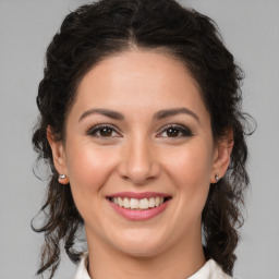 Joyful white young-adult female with medium  brown hair and brown eyes