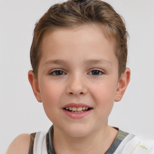 Joyful white child male with short  brown hair and brown eyes