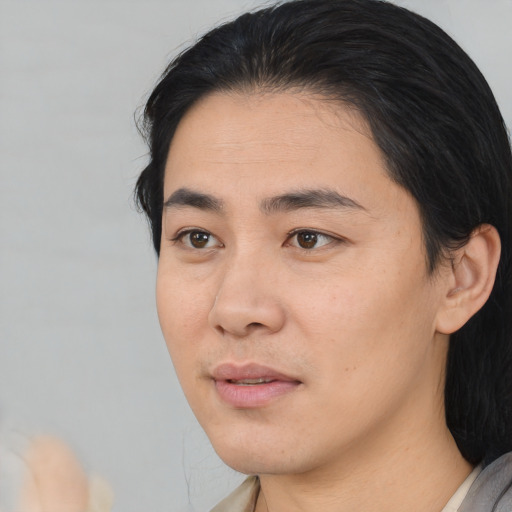 Joyful asian young-adult male with medium  black hair and brown eyes