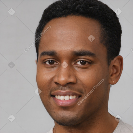 Joyful black young-adult male with short  black hair and brown eyes