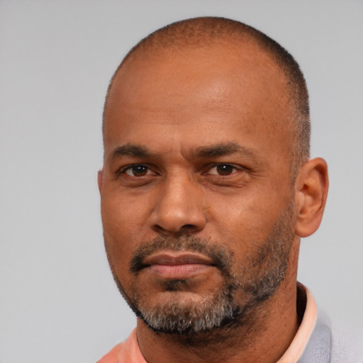 Neutral latino adult male with short  black hair and brown eyes