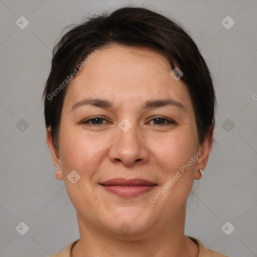 Joyful white adult female with short  brown hair and brown eyes