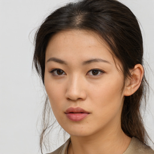 Neutral asian young-adult female with medium  brown hair and brown eyes
