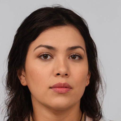 Neutral latino young-adult female with long  brown hair and brown eyes