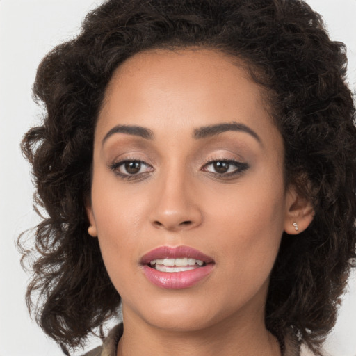 Joyful white young-adult female with long  brown hair and brown eyes