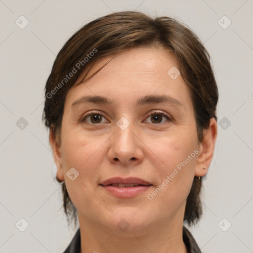 Joyful white adult female with medium  brown hair and brown eyes