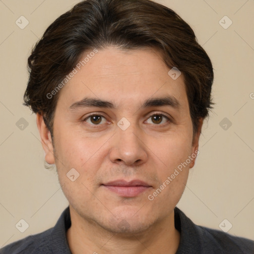 Joyful white adult male with short  brown hair and brown eyes