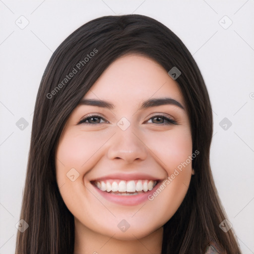 Joyful white young-adult female with long  black hair and brown eyes