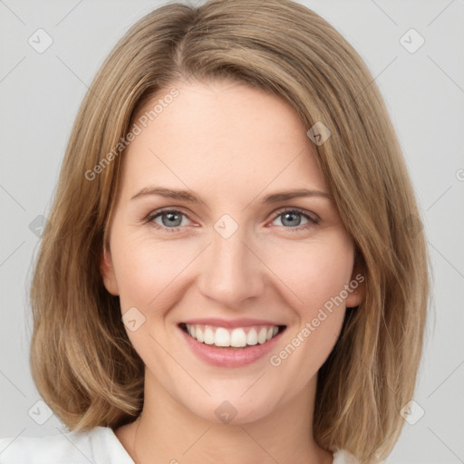 Joyful white young-adult female with medium  brown hair and green eyes