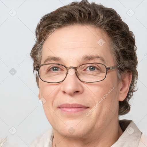 Joyful white adult female with short  brown hair and grey eyes