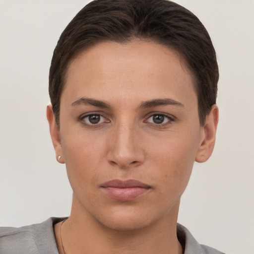 Neutral white young-adult female with short  brown hair and brown eyes