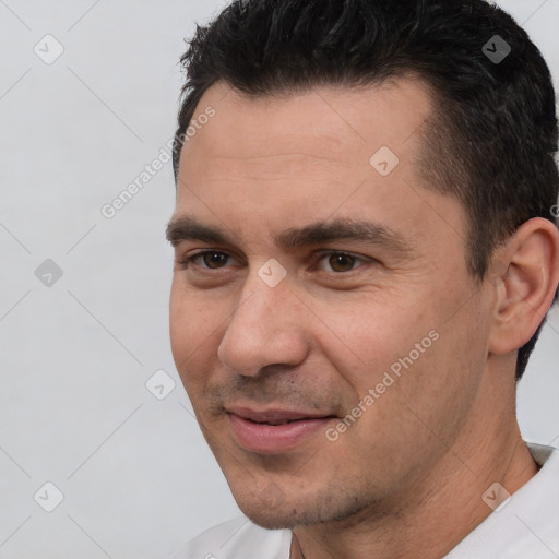 Joyful white adult male with short  brown hair and brown eyes