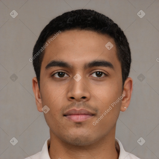 Neutral latino young-adult male with short  black hair and brown eyes