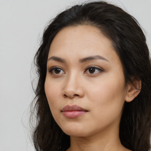 Neutral latino young-adult female with long  black hair and brown eyes
