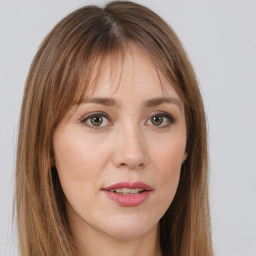 Joyful white young-adult female with long  brown hair and green eyes