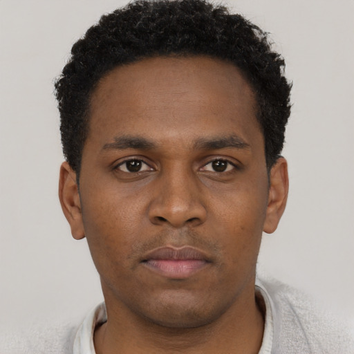 Neutral black young-adult male with short  brown hair and brown eyes